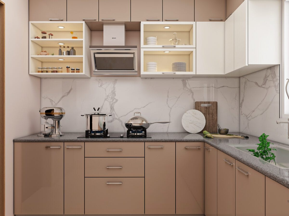 L-shaped modular kitchen with beige cabinets and marble backsplash by Splendid Interio