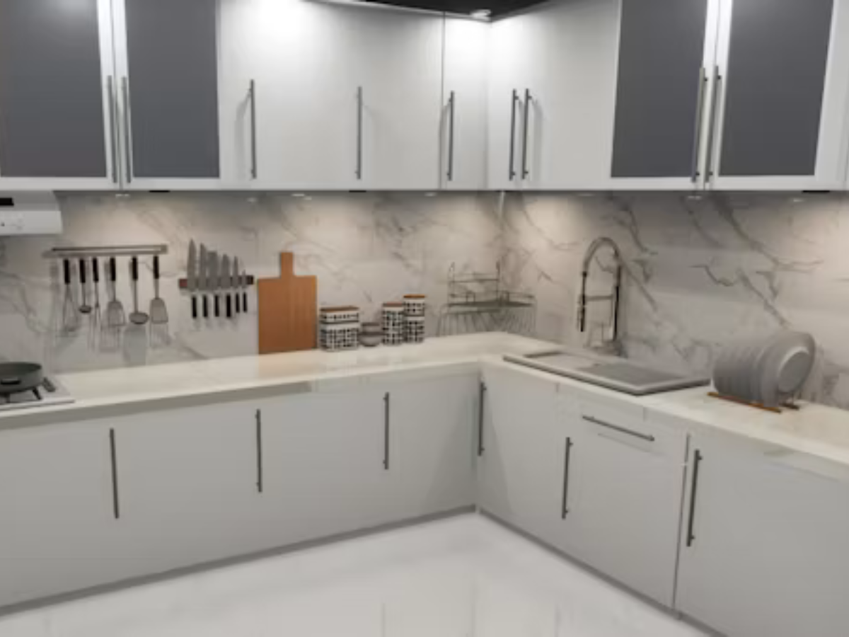 White grey L-shaped modular kitchen with marble backsplash by Splendid Interio